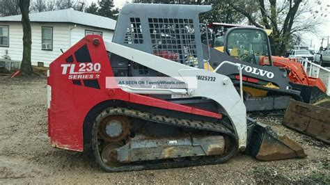 how to tilt cab on tl230 takeuchi skid steer|skidsteer tl10 cab height.